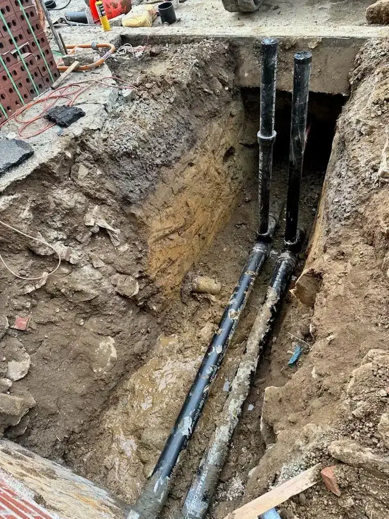 Sewer lateral trench with new pipe on an AlbPlumbing job in Philadelphia